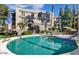 Community pool with surrounding patio and building in background at 5132 N 31St N Way # 134, Phoenix, AZ 85016