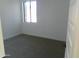 Simple bedroom with carpet flooring and a window at 846 N Pueblo Dr # 138, Casa Grande, AZ 85122