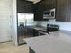 Modern kitchen with stainless steel appliances and an island at 846 N Pueblo Dr # 140, Casa Grande, AZ 85122