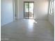 Bright and airy living room with tile floors and sliding doors at 846 N Pueblo Dr # 140, Casa Grande, AZ 85122