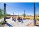 Community firepit with string lights and seating at 7577 S Towel Creek Dr, Gold Canyon, AZ 85118