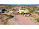 Aerial view of a stunning desert home with solar panels at 840 S Vulture Mine Rd, Wickenburg, AZ 85390