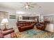 Comfortable living room showcasing an open floor plan with kitchen view at 2437 S Racine Ln, Gilbert, AZ 85295