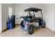 Garage with golf cart and storage shelving at 19562 N Wikieup Ct, Surprise, AZ 85374