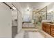 Luxurious bathroom with walk-in shower and soaking tub at 19562 N Wikieup Ct, Surprise, AZ 85374
