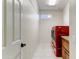 Laundry room with red appliances and granite countertop at 19562 N Wikieup Ct, Surprise, AZ 85374