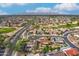 Wide aerial showcasing neighborhood, golf course, and mountains at 19562 N Wikieup Ct, Surprise, AZ 85374