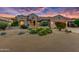 Single-story home exterior with desert landscaping at 19562 N Wikieup Ct, Surprise, AZ 85374