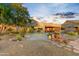 Beautiful desert landscape surrounds this single-story home at 19562 N Wikieup Ct, Surprise, AZ 85374