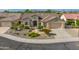 One-story home with landscaped yard and two-car garage at 19562 N Wikieup Ct, Surprise, AZ 85374