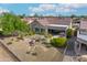 Spacious backyard oasis with covered patio and landscaping at 19562 N Wikieup Ct, Surprise, AZ 85374