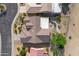 Overhead view of a single-story house with a tile roof and landscaped backyard at 19562 N Wikieup Ct, Surprise, AZ 85374