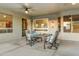Covered patio with seating area, perfect for outdoor dining at 19562 N Wikieup Ct, Surprise, AZ 85374
