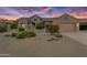 Charming one-story house with desert landscaping at 19562 N Wikieup Ct, Surprise, AZ 85374