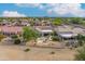 Community view showcasing multiple homes and landscaping at 19562 N Wikieup Ct, Surprise, AZ 85374