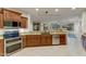 Kitchen features granite countertops, stainless steel appliances, and an island at 19562 N Wikieup Ct, Surprise, AZ 85374