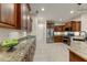 Spacious kitchen with granite countertops and stainless steel appliances at 19562 N Wikieup Ct, Surprise, AZ 85374