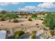 Landscaped backyard with golf course views at 19562 N Wikieup Ct, Surprise, AZ 85374