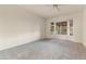 Spacious bedroom with large windows and ceiling fan at 19562 N Wikieup Ct, Surprise, AZ 85374