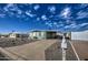 Mobile home exterior with gravel landscaping and a carport at 260 S 72Nd Pl, Mesa, AZ 85208