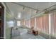 Sunroom with seating area and view to backyard at 260 S 72Nd Pl, Mesa, AZ 85208