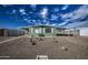 Mobile home with a well-maintained front yard and gravel landscaping at 260 S 72Nd Pl, Mesa, AZ 85208