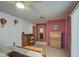 Bedroom with a queen bed, dresser, and built-in desk at 260 S 72Nd Pl, Mesa, AZ 85208