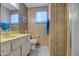 Clean bathroom with yellow vanity, toilet, and shower at 260 S 72Nd Pl, Mesa, AZ 85208