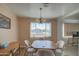 Bright dining area with wood table and chairs, offering views to the outside at 260 S 72Nd Pl, Mesa, AZ 85208