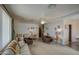 Living room with two armchairs, sofa, and a TV stand at 260 S 72Nd Pl, Mesa, AZ 85208