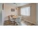 Bright dining room with a wood table, four chairs, and a chandelier at 260 S 72Nd Pl, Mesa, AZ 85208