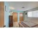 Bedroom with a twin bed, dresser, and wood floors at 260 S 72Nd Pl, Mesa, AZ 85208