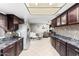 Open kitchen with ample counter space and views into the dining area at 2349 W Del Campo Cir, Mesa, AZ 85202