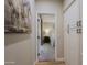 Hallway with built-in storage and view into bedroom at 7086 E Whispering Mesquite Trl, Scottsdale, AZ 85266