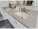 Double vanity bathroom with gray quartz countertops and modern faucets at 7086 E Whispering Mesquite Trl, Scottsdale, AZ 85266