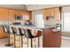 Island kitchen with granite countertops, stainless steel appliances, and seating at 3233 N 37Th St # 5, Phoenix, AZ 85018