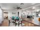 Dining area features a dark wood table and chairs, with an open view to kitchen at 2518 E Campbell Ave, Phoenix, AZ 85016