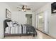 Bright bedroom with a comfortable bed and access to a private patio at 2518 E Campbell Ave, Phoenix, AZ 85016