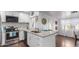 Modern kitchen with white cabinets, granite countertops, and stainless steel appliances at 2518 E Campbell Ave, Phoenix, AZ 85016