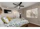 Charming bedroom with a ceiling fan and access to the bathroom at 2518 E Campbell Ave, Phoenix, AZ 85016