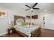 Comfortable bedroom with ceiling fan and en-suite bathroom access at 2518 E Campbell Ave, Phoenix, AZ 85016