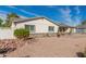 House exterior showcasing a stone accent and neat landscaping at 2518 E Campbell Ave, Phoenix, AZ 85016