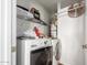 Convenient laundry room with washer, dryer, and shelving at 2518 E Campbell Ave, Phoenix, AZ 85016