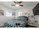 Charming bedroom with a unique geometric bedding and accent wall at 2518 E Campbell Ave, Phoenix, AZ 85016