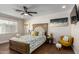 Spacious bedroom with a ceiling fan and plenty of natural light at 2518 E Campbell Ave, Phoenix, AZ 85016