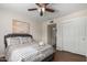Well-lit bedroom with a queen bed and ample closet space at 2518 E Campbell Ave, Phoenix, AZ 85016