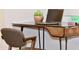 Modern home office features a glass desk and comfortable chair at 103 E Palm Ln # A, Phoenix, AZ 85004