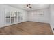 Light and airy living room with wood floors and sliding doors at 103 E Palm Ln # A, Phoenix, AZ 85004
