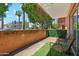 Private patio area with artificial turf and seating at 103 E Palm Ln # A, Phoenix, AZ 85004