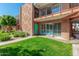 Condo building exterior with landscaped lawn and walkway at 103 E Palm Ln # A, Phoenix, AZ 85004